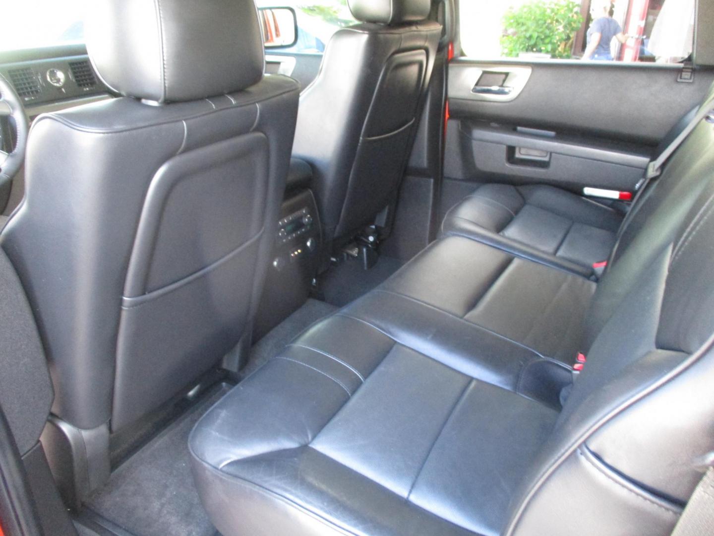 2008 Orange /Black HUMMER H2 Base (5GRGN23868H) with an 6.2L V8 OHV 16V engine, 6-Speed Automatic Overdrive transmission, located at 4724 53rd Ave East, Suite 1, Bradenton, FL, 34203, (941) 803-7117, 27.445360, -82.501678 - Photo#10