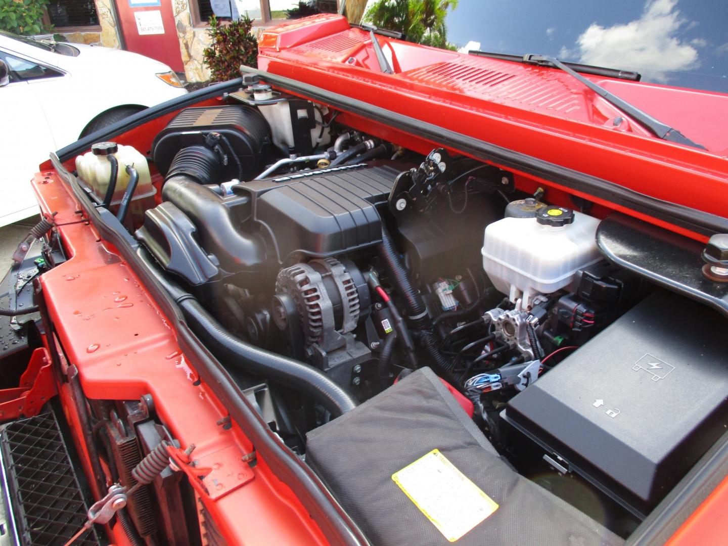 2008 Orange /Black HUMMER H2 Base (5GRGN23868H) with an 6.2L V8 OHV 16V engine, 6-Speed Automatic Overdrive transmission, located at 4724 53rd Ave East, Suite 1, Bradenton, FL, 34203, (941) 803-7117, 27.445360, -82.501678 - Photo#7